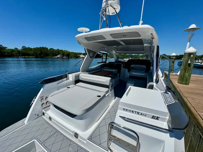  Yacht Photos Pics 2025 Beneteau Gran Turismo 36 yacht docked, showcasing sleek design and spacious deck.