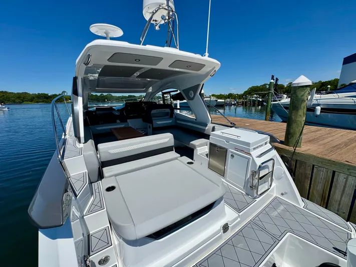  Yacht Photos Pics 2025 Beneteau Gran Turismo 36 yacht docked, featuring spacious deck and modern amenities.