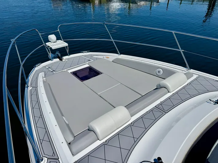 Yacht Photos Pics 2025 Beneteau Gran Turismo 36 yacht with spacious sunbathing deck on calm water.