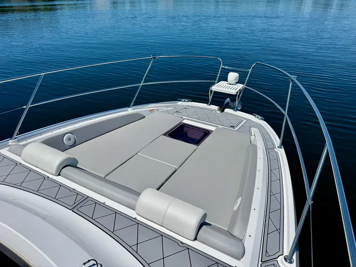  Yacht Photos Pics 2025 Beneteau Gran Turismo 36 yacht with spacious sunbathing deck on calm water.