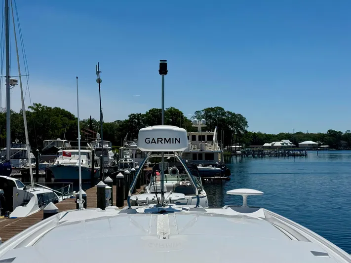  Yacht Photos Pics 2025 Beneteau Gran Turismo 36 yacht docked, featuring Garmin equipment, with scenic marina backdrop.