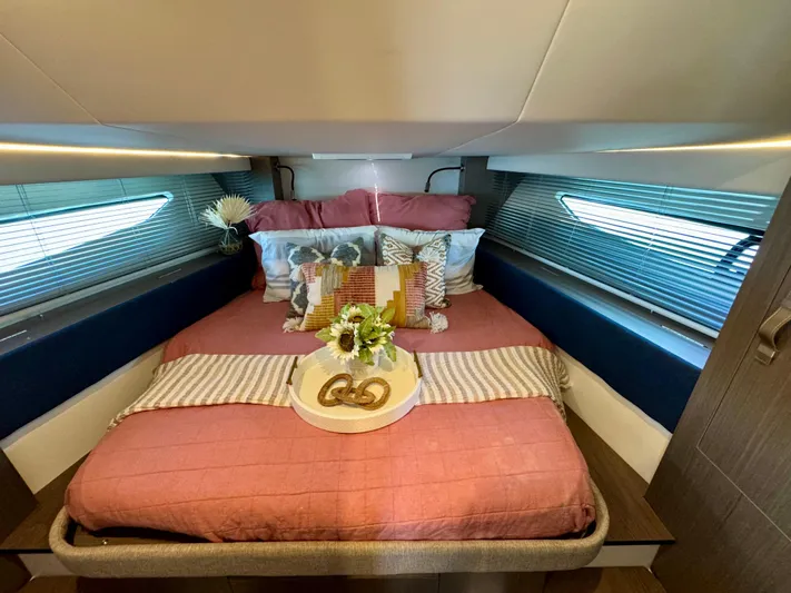  Yacht Photos Pics Luxurious cabin interior of 2025 Beneteau Gran Turismo 36 yacht with cozy bedding.