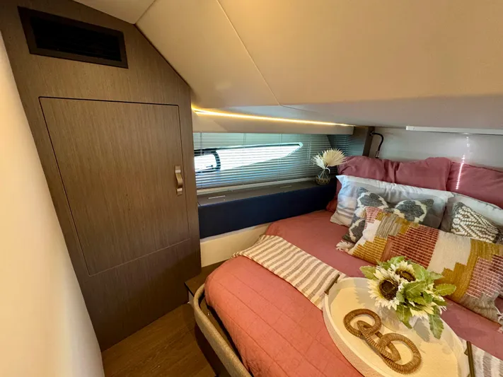  Yacht Photos Pics Luxurious cabin interior of 2025 Beneteau Gran Turismo 36 yacht with cozy bedding.