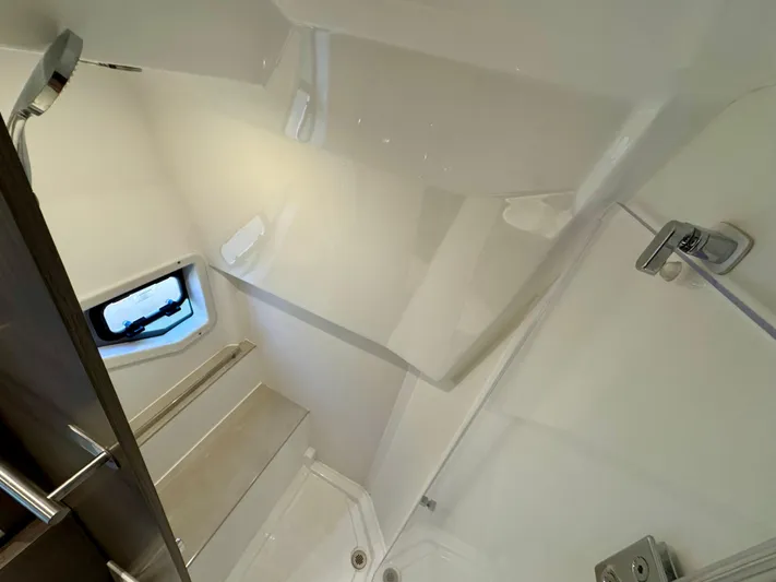  Yacht Photos Pics 2025 Beneteau Gran Turismo 36 yacht interior, featuring a modern bathroom with sleek fixtures.