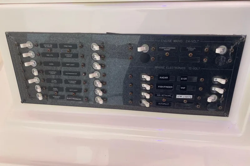 Gettsea Yacht Photos Pics Control panel of a 2008 Silverton 45 Convertible boat with labeled switches and electronics.