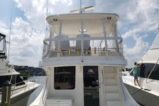 Gettsea Yacht Photos Pics 2008 Silverton 45 Convertible yacht docked under a partly cloudy sky.