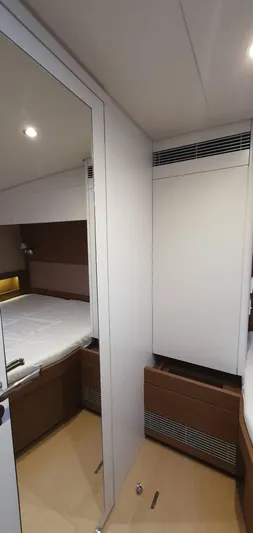 Aida II Yacht Photos Pics Interior of 2018 CNB 66 yacht cabin with modern design and wood accents.