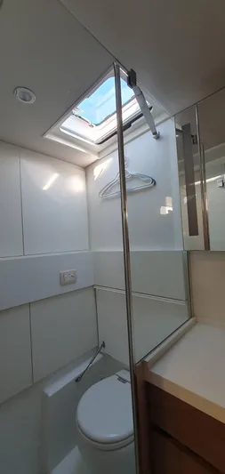 Aida II Yacht Photos Pics Modern bathroom in 2018 CNB 66 yacht with skylight and glass shower.