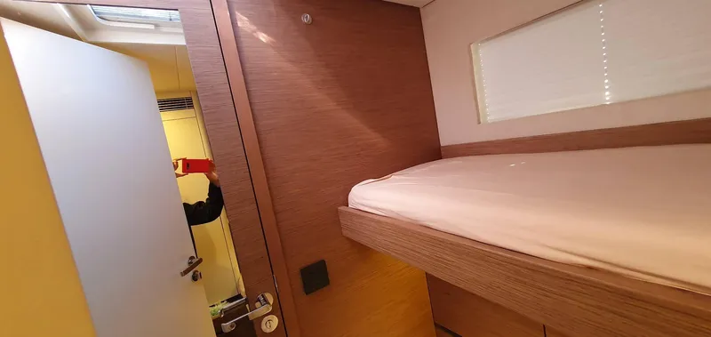 Aida II Yacht Photos Pics Small cabin interior with wooden bunk bed on a 2018 CNB 66 yacht.