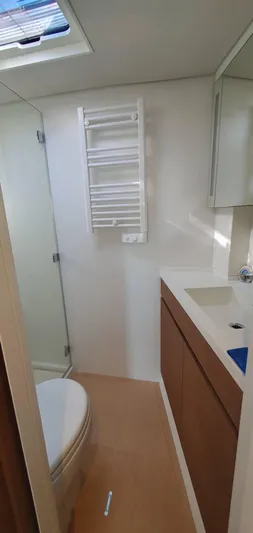 Aida II Yacht Photos Pics Modern yacht bathroom with shower, toilet, and sink. CNB 66, 2018 model.