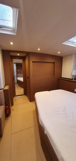 Aida II Yacht Photos Pics Luxurious cabin interior of 2018 CNB 66 yacht with modern wood finish.