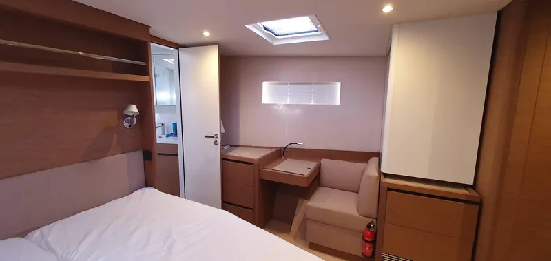 Aida II Yacht Photos Pics Luxurious cabin interior of 2018 CNB 66 yacht with modern furnishings and natural lighting.