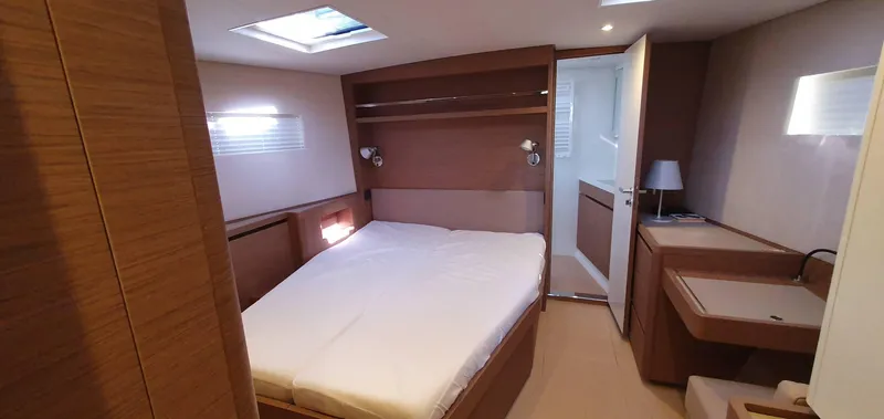 Aida II Yacht Photos Pics Luxurious cabin interior of 2018 CNB 66 yacht with modern wood finish.