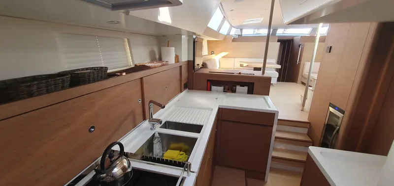 Aida II Yacht Photos Pics Luxurious interior of 2018 CNB 66 yacht with modern kitchen and spacious living area.