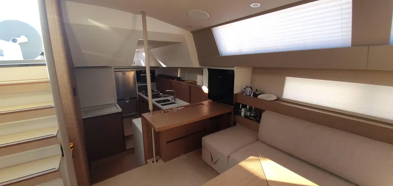 Aida II Yacht Photos Pics Luxurious interior of 2018 CNB 66 yacht with modern kitchen and seating area.