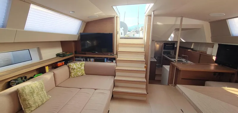 Aida II Yacht Photos Pics Luxurious interior of 2018 CNB 66 yacht with modern furnishings and natural light.