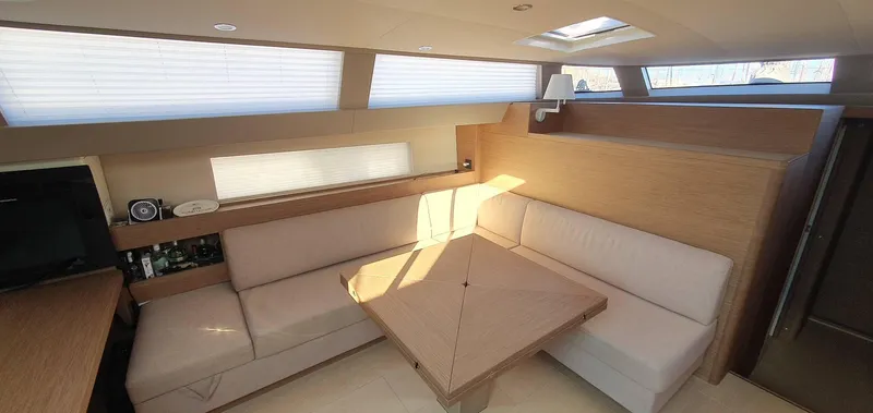 Aida II Yacht Photos Pics Luxurious interior of 2018 CNB 66 yacht with elegant seating and natural light.