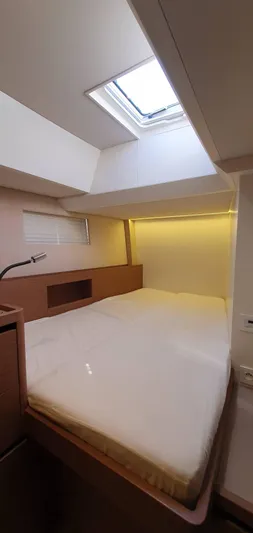 Aida II Yacht Photos Pics Luxurious cabin interior of 2018 CNB 66 yacht with skylight and modern design.