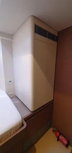 Aida II Yacht Photos Pics Interior of CNB 66 yacht, 2018 model, featuring a sleek cabinet and fire extinguisher.