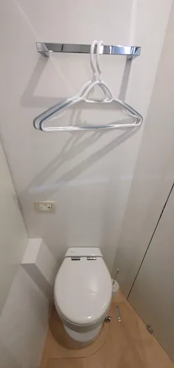 Aida II Yacht Photos Pics Small bathroom with toilet, wall-mounted hangers, and minimalistic design. CNB 66, 2018 model.