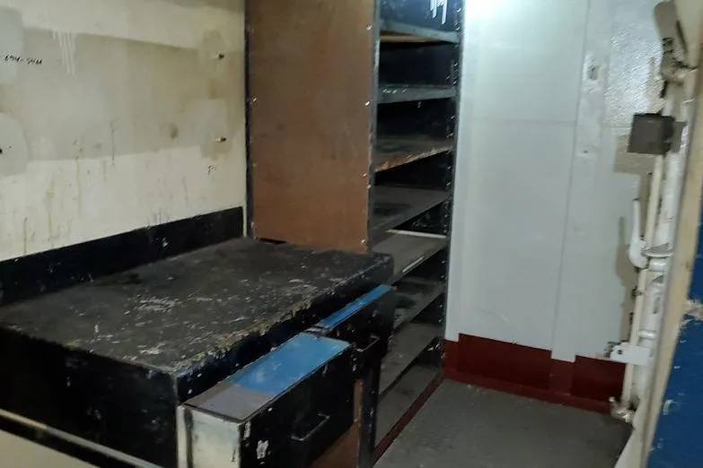  Yacht Photos Pics Interior of 1970 COMMERICAL BOAT LCU-135 with shelves and workbench.