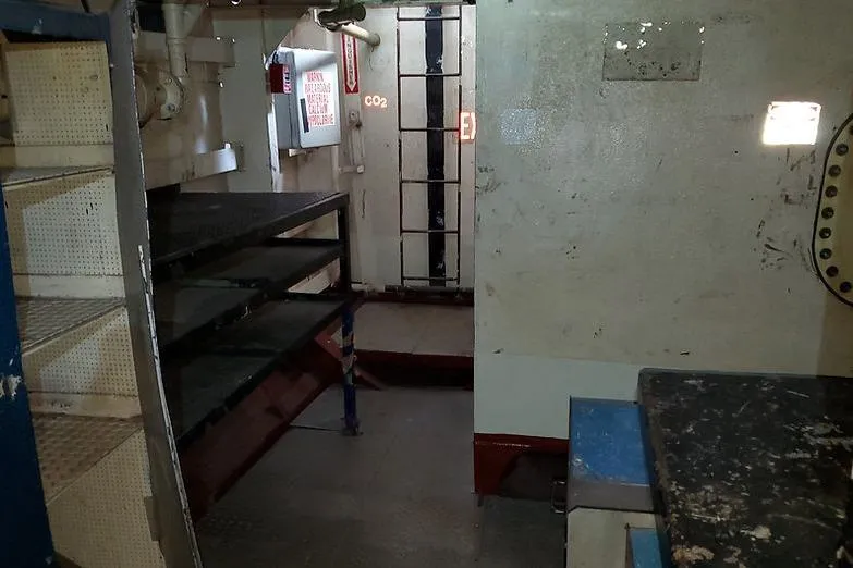  Yacht Photos Pics Interior of 1970 COMMERICAL BOAT LCU-135, featuring metal shelves and industrial design.