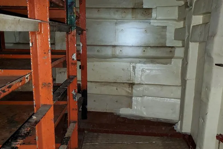  Yacht Photos Pics Interior of 1970 COMMERICAL BOAT LCU-135 with metal shelves and insulated walls.