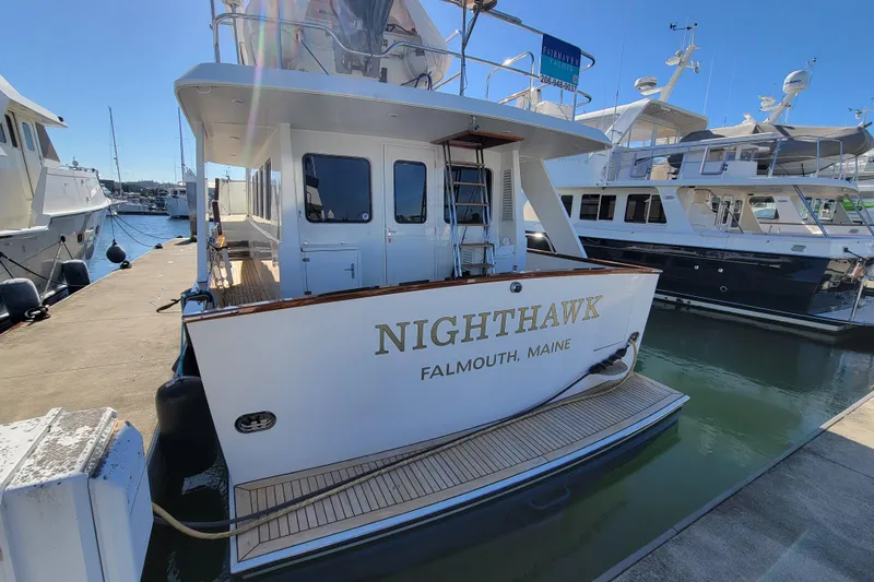 Nighthawk Yacht Photos Pics Lyman-Morse 1999 pilothouse yacht "Nighthawk" docked in Falmouth, Maine marina.