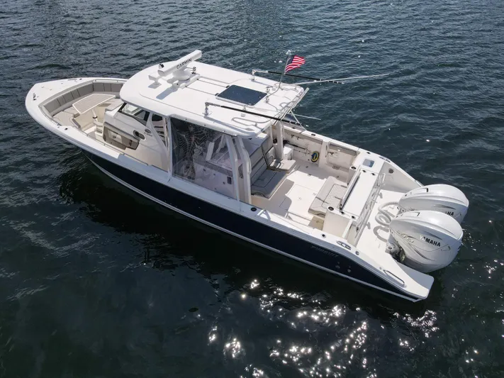  Yacht Photos Pics 2022 Pursuit S 358 Sport boat on water, featuring dual Yamaha engines.