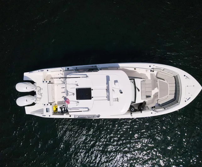  Yacht Photos Pics Overhead view of 2022 Pursuit S 358 Sport boat on dark water.