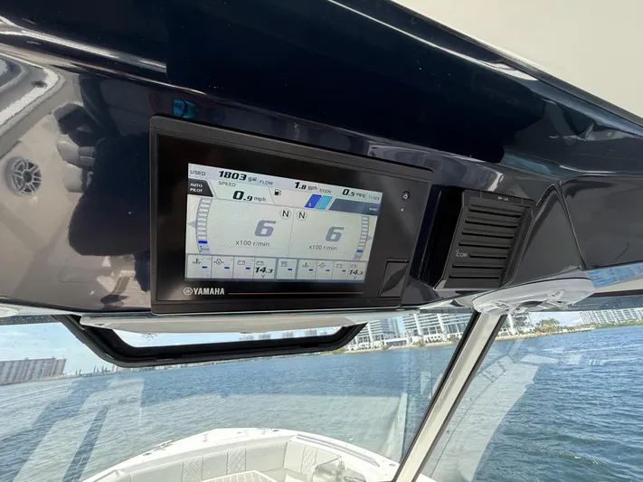  Yacht Photos Pics Dashboard of 2022 Pursuit S 358 Sport boat with Yamaha display on water.