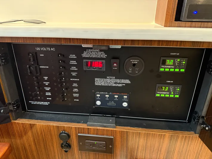  Yacht Photos Pics Electrical control panel of 2022 Pursuit S 358 Sport boat, featuring voltage and system monitors.