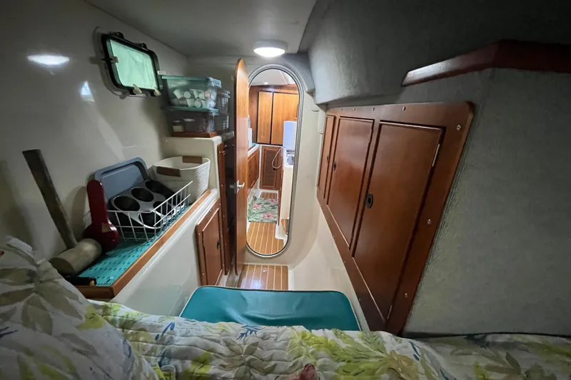  Yacht Photos Pics Cozy interior of 2004 PDQ Passage Maker with wooden cabinets and nautical decor.