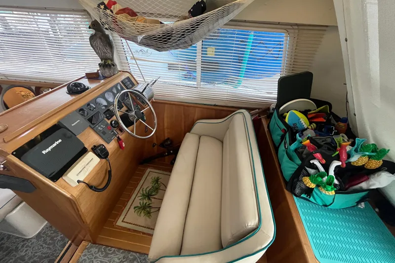  Yacht Photos Pics Cozy 2004 PDQ Passage Maker helm with nautical decor and organized storage.