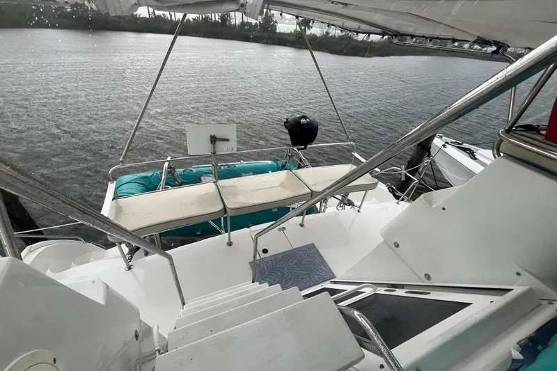  Yacht Photos Pics 2004 PDQ Passage Maker yacht deck with water view and seating area.