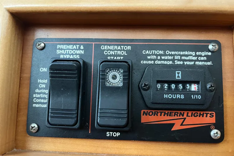  Yacht Photos Pics Control panel of a 2004 PDQ Passage Maker with generator hour meter and switches.
