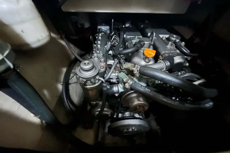  Yacht Photos Pics Engine compartment of a 2004 PDQ Passage Maker with visible hoses and components.