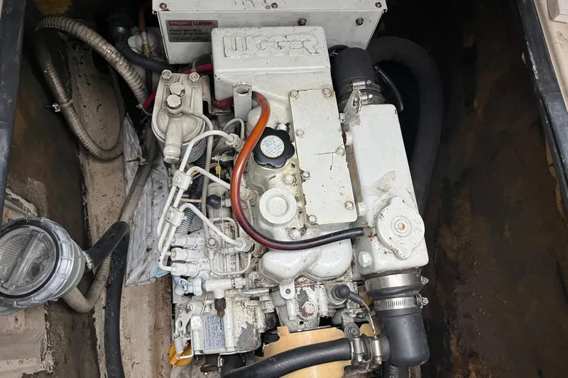  Yacht Photos Pics Engine compartment of a 2004 PDQ Passage Maker boat, showcasing mechanical components.