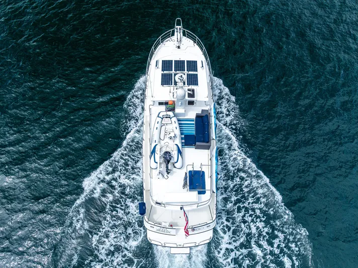 Speakeasy Yacht Photos Pics Nordic Tug 54 (2007) cruising on open water, aerial view.
