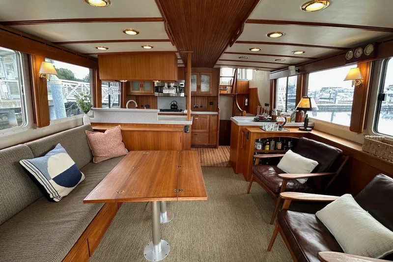Speakeasy Yacht Photos Pics Luxurious 2007 Nordic Tug 54 interior with elegant wood finishes and comfortable seating.