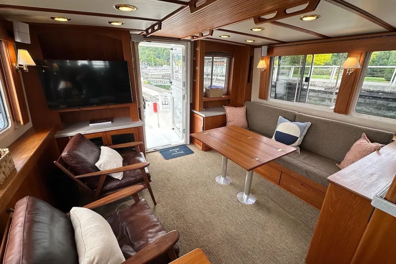 Speakeasy Yacht Photos Pics Luxurious 2007 Nordic Tug 54 interior with cozy seating and elegant wood finishes.