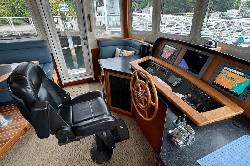 Speakeasy Yacht Photos Pics Pilot house of 2007 Nordic Tug 54 with navigation equipment and captain's chair.