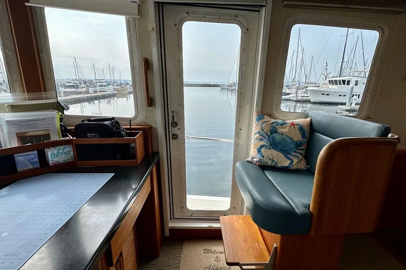 Speakeasy Yacht Photos Pics Interior of 2007 Nordic Tug 54 with marina view through windows.
