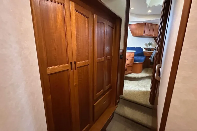 Speakeasy Yacht Photos Pics Interior of 2007 Nordic Tug 54, featuring wooden cabinetry and cozy seating area.