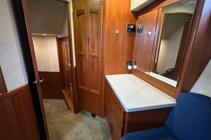 Speakeasy Yacht Photos Pics Interior of 2007 Nordic Tug 54, featuring wooden cabinetry and a mirror above a countertop.