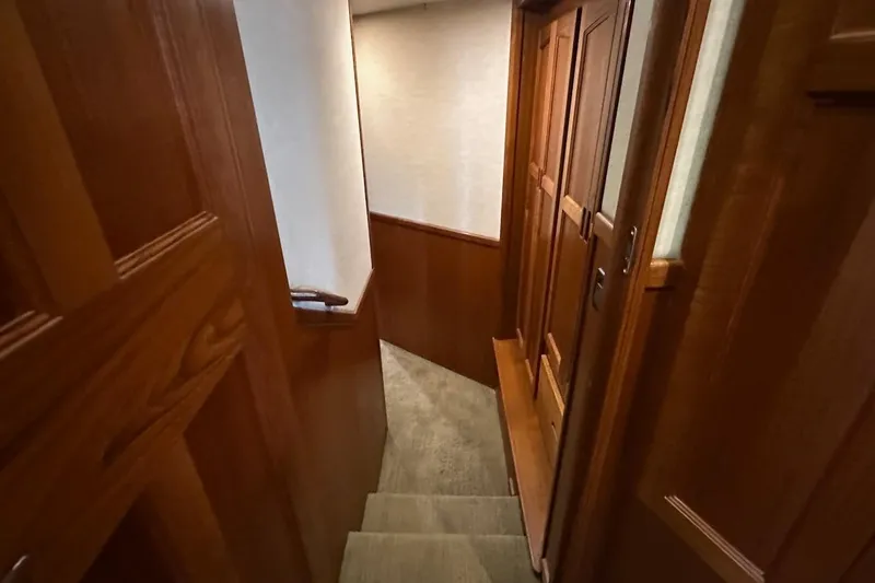 Speakeasy Yacht Photos Pics Staircase with wooden paneling inside a 2007 Nordic Tug 54 yacht.