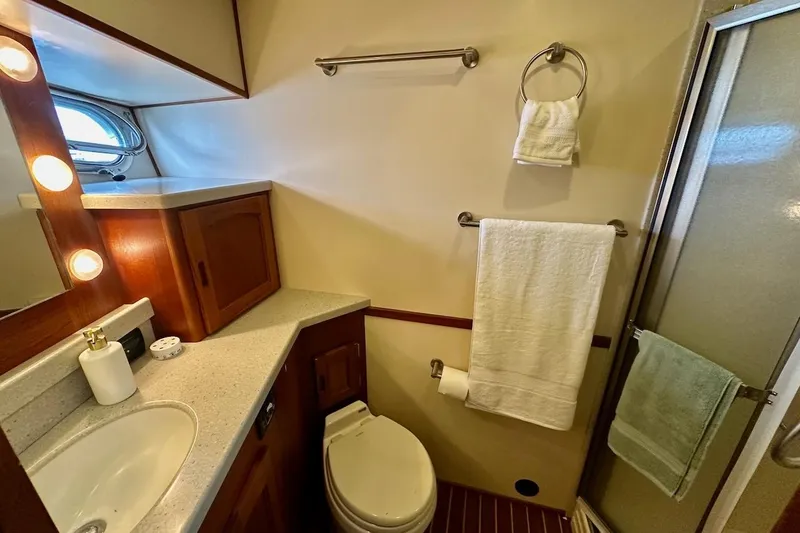 Speakeasy Yacht Photos Pics Luxurious bathroom in 2007 Nordic Tug 54 yacht with modern fixtures and elegant design.