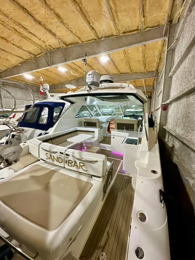 Sand Bar Yacht Photos Pics 2011 Sea Ray 450 Sundancer yacht in storage, featuring spacious deck and modern design.