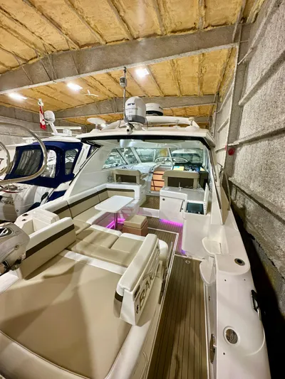 Sand Bar Yacht Photos Pics 2011 Sea Ray 450 Sundancer yacht in a storage facility, featuring spacious seating and modern design.