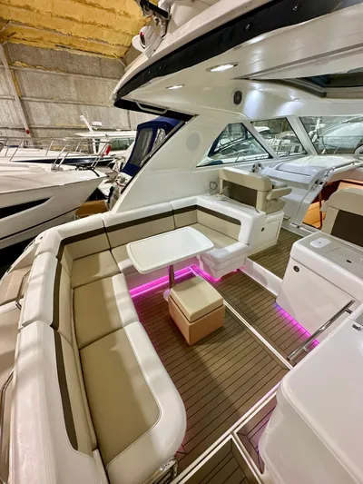 Sand Bar Yacht Photos Pics 2011 Sea Ray 450 Sundancer yacht interior with seating, table, and ambient lighting.